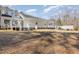 Large grassy backyard featuring a multi-tiered deck and patio area perfect for entertaining at 902 Zion Church Rd, Sanford, NC 27330
