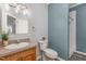 Bathroom with traditional vanity, ample countertop space, and combined shower and tub at 902 Zion Church Rd, Sanford, NC 27330