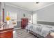 Bedroom with natural light, hardwood floors, and neutral wall colors at 902 Zion Church Rd, Sanford, NC 27330