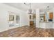 Bright dining room with stylish light fixture and hardwood floors at 902 Zion Church Rd, Sanford, NC 27330