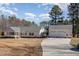 Lovely ranch style home with attached 3-car garage and beautiful lawn at 902 Zion Church Rd, Sanford, NC 27330