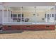 Charming front porch with white railing and brick foundation at 902 Zion Church Rd, Sanford, NC 27330