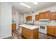 Updated kitchen with an island, recessed lighting, and white countertops at 902 Zion Church Rd, Sanford, NC 27330