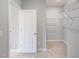 Spacious walk-in closet includes ample shelving and storage solutions at 909 Thimbleweed Way, Wake Forest, NC 27587