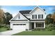 Charming two-story home featuring a classic design, well-maintained landscaping, and attached two-car garage at 913 Thimbleweed Way, Wake Forest, NC 27587