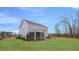 Beautiful home exterior with lush green lawn and a screened-in patio at 913 Thimbleweed Way, Wake Forest, NC 27587