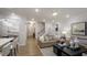 Inviting living room showcases an open floor plan with hardwood floors and comfortable seating arrangement at 913 Thimbleweed Way, Wake Forest, NC 27587