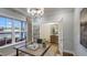 Well-lit home office featuring modern decor, glass doors, and neutral tones, creating a serene workspace at 913 Thimbleweed Way, Wake Forest, NC 27587