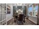 Stylish home office with dark accent wall, desk, decorative rug, and ample natural light from the window at 913 Thimbleweed Way, Wake Forest, NC 27587