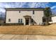 The backyard has a small porch and a yard needing some landscaping love at 100 Pinto Saddle Ct, Garner, NC 27529