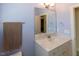 Bathroom with a marble vanity, sink, and towel rack, creating an elegant, functional space at 100 Pinto Saddle Ct, Garner, NC 27529