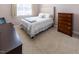 Bedroom featuring a bed with a white comforter, desk and chair, and wood dresser at 100 Pinto Saddle Ct, Garner, NC 27529