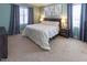 Inviting bedroom with large windows, soft carpet, and stylish decor and a view at 100 Pinto Saddle Ct, Garner, NC 27529
