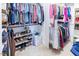 Walk-in closet featuring organized shelving, hanging racks, and ample storage space at 100 Pinto Saddle Ct, Garner, NC 27529