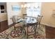 Cozy dining area with glass table and seating for four at 100 Pinto Saddle Ct, Garner, NC 27529