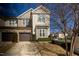 Two-story townhome featuring a tandem garage, stone accents and beautiful landscaping at 100 Pinto Saddle Ct, Garner, NC 27529