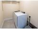 Laundry room featuring a white washer and dryer, maximizing efficiency and convenience at 100 Pinto Saddle Ct, Garner, NC 27529