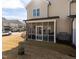 Screened patio with outdoor seating and a grill, perfect for enjoying outdoor living and gatherings at 100 Pinto Saddle Ct, Garner, NC 27529