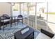 Relaxing screened porch with stylish furniture, and a view of the yard at 100 Pinto Saddle Ct, Garner, NC 27529