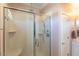 A beautifully designed shower with a frameless glass door and updated fixtures at 100 Pinto Saddle Ct, Garner, NC 27529