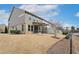 Exterior view of home with a screened porch, spacious backyard, and well-maintained lawn at 1015 Rexburg Dr, Cary, NC 27513