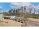 Landscaped backyard with a fence, and pond view at 1015 Rexburg Dr, Cary, NC 27513
