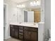 Bright bathroom with dual sinks, ample counter space, vanity cabinets, and recessed lighting at 1015 Rexburg Dr, Cary, NC 27513