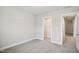Bedroom with neutral carpet, doorway to hall with closet visible, and base trim at 1015 Rexburg Dr, Cary, NC 27513