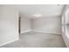 Neutral bedroom with carpet, natural light from window on the right, and white trim at 1015 Rexburg Dr, Cary, NC 27513
