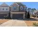 Charming two-story home with a two-car garage and inviting brick and siding exterior at 1015 Rexburg Dr, Cary, NC 27513