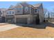 Charming two-story home with a two-car garage and inviting brick and siding exterior at 1015 Rexburg Dr, Cary, NC 27513
