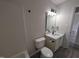 Recently remodeled bathroom with a sleek vanity, tub/shower, and neutral colors at 1032 Holly Pointe Dr, Wendell, NC 27591