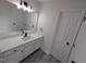 Modern bathroom featuring a new vanity and mirror, fresh paint and new fixtures at 1032 Holly Pointe Dr, Wendell, NC 27591