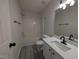 Bathroom featuring a modern vanity, updated lighting, and tub/shower combo at 1032 Holly Pointe Dr, Wendell, NC 27591