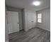 Cozy bedroom showcasing modern flooring and ample closet space at 1032 Holly Pointe Dr, Wendell, NC 27591