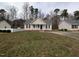 Charming single-story home with neutral siding, black shutters, and a cozy, white picket front porch at 1032 Holly Pointe Dr, Wendell, NC 27591