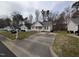 Charming single-story home with neutral siding, black shutters, and a cozy, white picket front porch at 1032 Holly Pointe Dr, Wendell, NC 27591