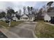 Charming single-story home with neutral siding, black shutters, and a cozy, white picket front porch at 1032 Holly Pointe Dr, Wendell, NC 27591