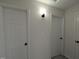 Hallway features white walls and multiple doors at 1032 Holly Pointe Dr, Wendell, NC 27591
