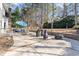 Expansive backyard patio with outdoor seating, grill and basketball hoop for outdoor entertaining at 104 Glenmore Rd, Cary, NC 27519