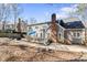 Well-maintained backyard with patio, deck, mature trees and landscaping at 104 Glenmore Rd, Cary, NC 27519