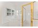 Bright bathroom with a tub, glass shower and window allowing natural light to fill the space at 104 Glenmore Rd, Cary, NC 27519