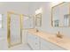 Elegant bathroom featuring a double sink vanity, gold fixtures, and a glass-enclosed shower at 104 Glenmore Rd, Cary, NC 27519