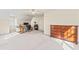 Open bedroom/office area with carpeted floors, windows for natural light, and a wooden dresser at 104 Glenmore Rd, Cary, NC 27519