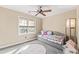 A carpeted bedroom is fitted with a daybed, floor lamp, area rug and window at 104 Glenmore Rd, Cary, NC 27519