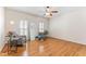 Serene bedroom with hardwood floors, lots of natural light, and accent seating at 104 Glenmore Rd, Cary, NC 27519