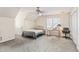 Bright bedroom with carpet, complemented by a simple desk and chair, a ceiling fan, and closet at 104 Glenmore Rd, Cary, NC 27519