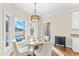 Bright breakfast nook with bay window, table, and chairs perfect for enjoying morning sunlight at 104 Glenmore Rd, Cary, NC 27519