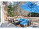 Enjoy outdoor relaxation on this deck with a blue sofa, complete with stylish outdoor furniture at 104 Glenmore Rd, Cary, NC 27519