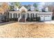 Charming gray two-story home with dormer windows and a well-manicured front yard at 104 Glenmore Rd, Cary, NC 27519